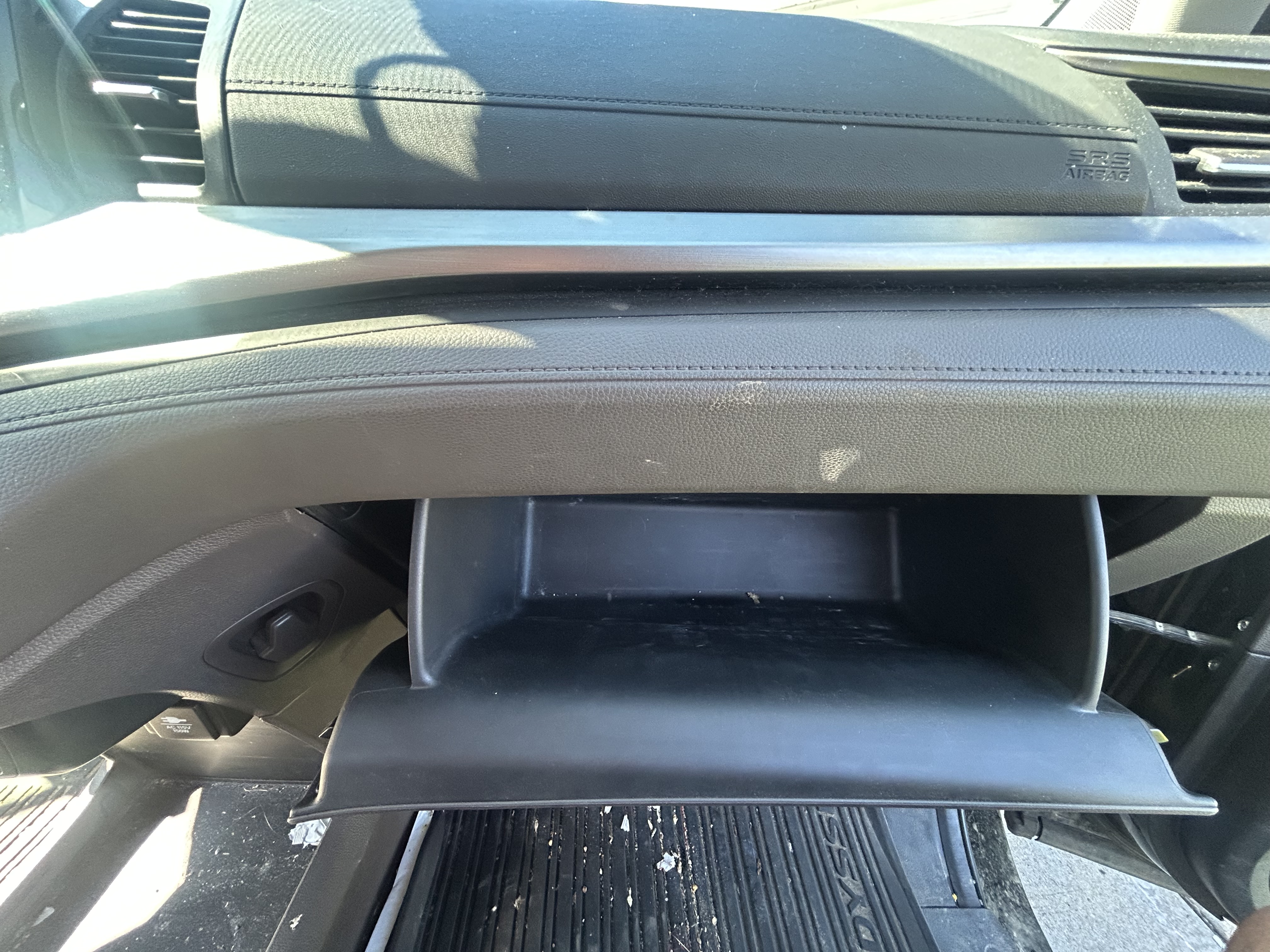 Textured glove box and dashboard before detailing